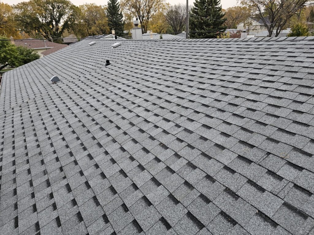 Completed residential roof replacement wide view